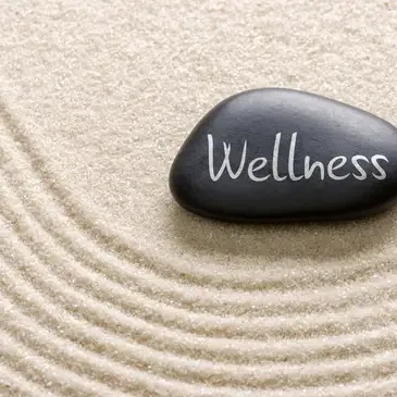 Wellness stone on sand