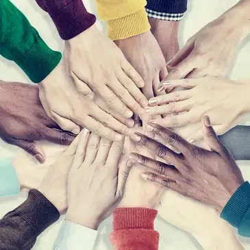 Diverse hands stacked together